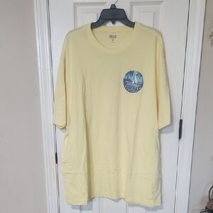 Izod Men’s Pale Yellow Short Sleeve Tee with Blue Sail Graphic